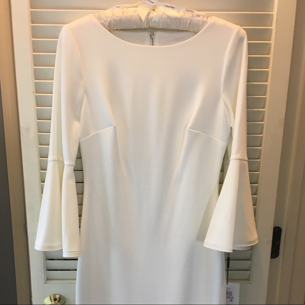 Brand new Calvin Klein dress with bell sleeves.